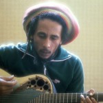 Bob Marley playing guitar