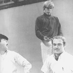 Dennis Wilson flips Mike Love the bird while brother Carl looks on in astonishment.