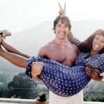 Donna Summer gets a lift from body builder, future movie star and politician Arnold Schwarzenegger at her home in April 1977 in Los Angeles, California.