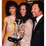 Donna Summer poses for a portrait with singers Marilyn McCoo and Billy Davis, Jr. of the R&B vocal group 5th Dimension at the Billboard Number 1 Music Awards in circa 1980.