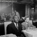 Charlie Parker and Red Rodney watching Dizzy Gillespie