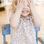Young Girl Playing Peek-a-Boo