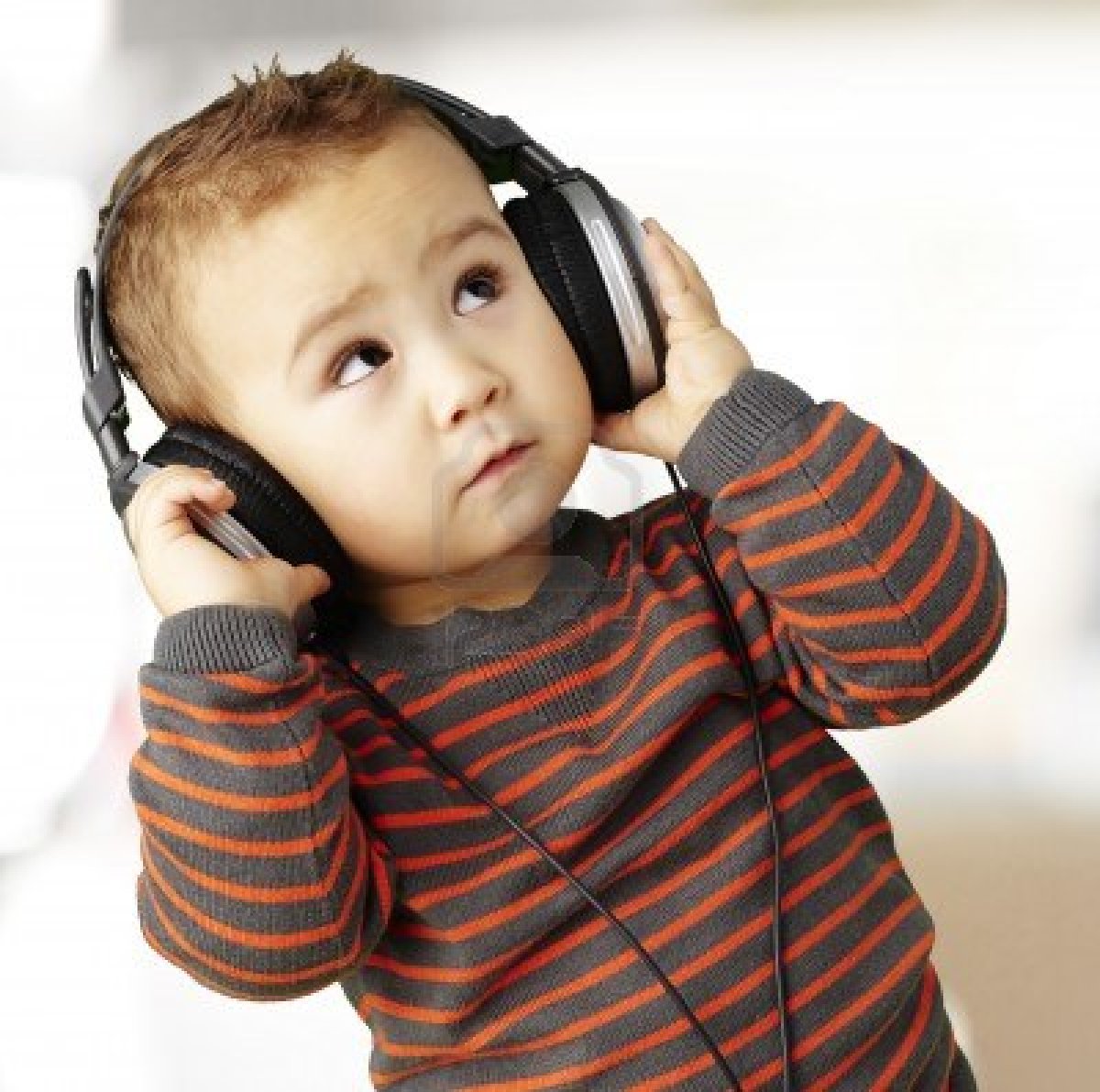 13485840-young-kid-wearing-headphones-and-listening-to-music-indoor - That Eric Alper