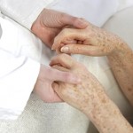 Palliative care: a therapist holds a client’s hands