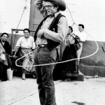 James Dean showing off his lasso skills on the set of Giant.