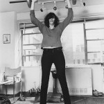 Joey Ramone lifting weights.