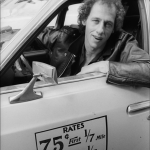 Dire Straits lead guitar Mark Knopfler drives a New York City taxi, 1979