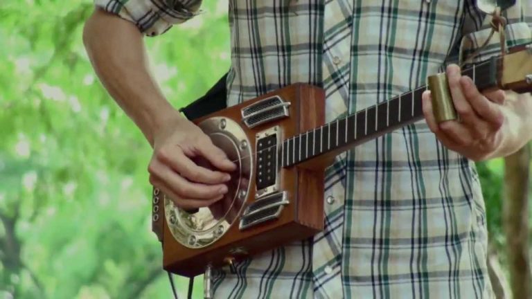Guy uses a homemade guitar and loop pedal to make mind-blowing music
