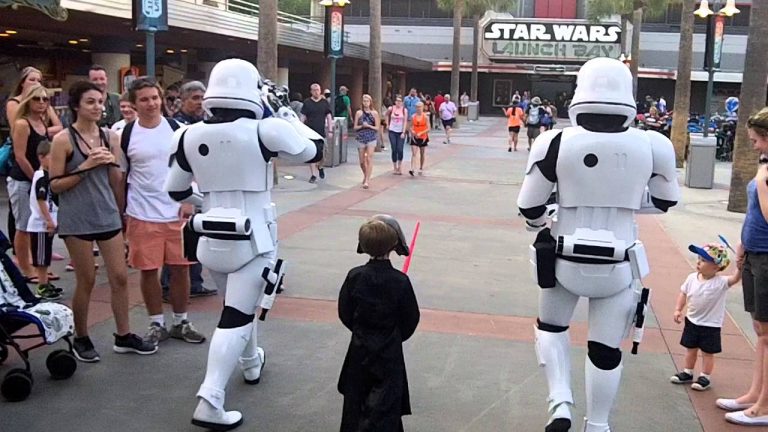 Storm Troopers Escort Kid Dressed As Kylo Ren