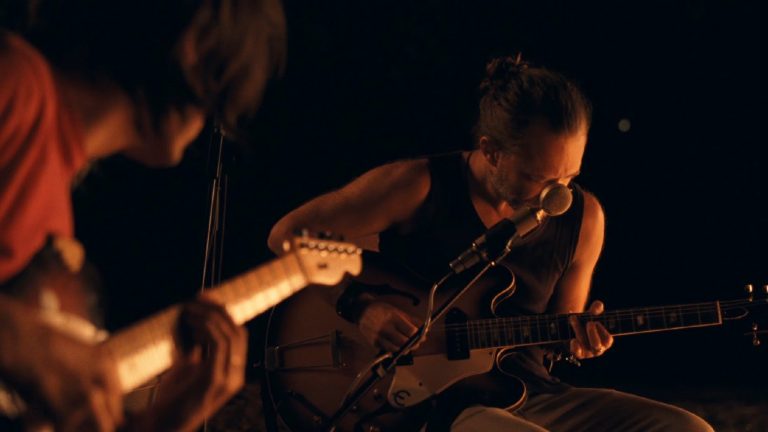 Radiohead Performs “Present Tense” In Stripped-Down Video Directed By Paul Thomas Anderson