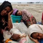 exhausted_rohingya_refugees_rest_on_the_shore_after_crossing_the_bangladesh-myanmar_border_by_boat_through_the_bay_of_bengal_in_shah_porir_dwip_bangladesh_september_10_2017._reuters