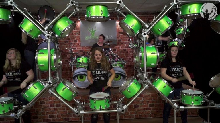 Drummers Play Eight Green Drums At The Same Time