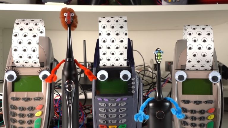 Two Googly-Eyed Electric Toothbrushes And Three Credit Card Machines Perform Haddaway’s “What Is Love”