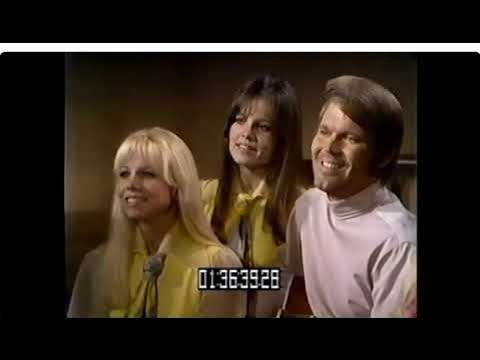 Glen Campbell and The Clinger Sisters Shine on 1968 Cover of “We’ll Sing in the Sunshine”