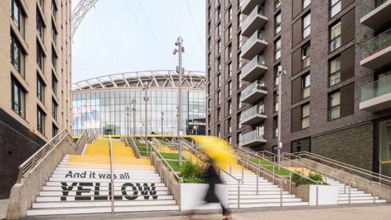 Wembley Park & Pantone Unveil ‘Yellow 25’ Installation Honoring Coldplay’s “‘Yellow’” Ahead of 10 Sold-Out Stadium Shows