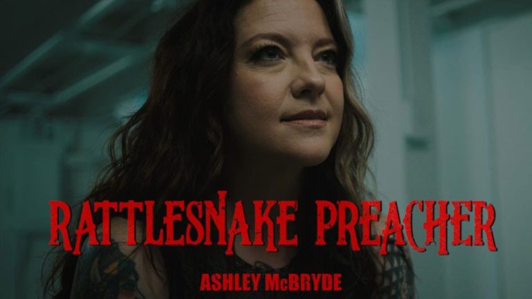 Ashley McBryde Brings Fire And Memory To Striking New “Rattlesnake Preacher” Video