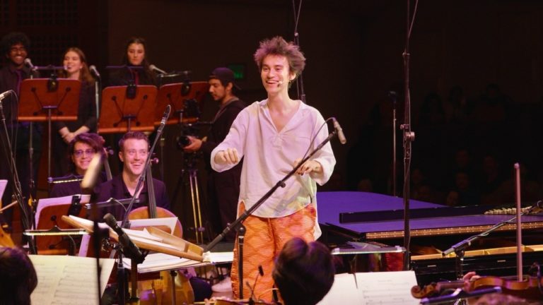 Jacob Collier Directs Audience Symphony Orchestra In Surprise Live Performance